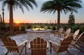 View of patio / terrace with an outdoor fire pit at Oasis Club