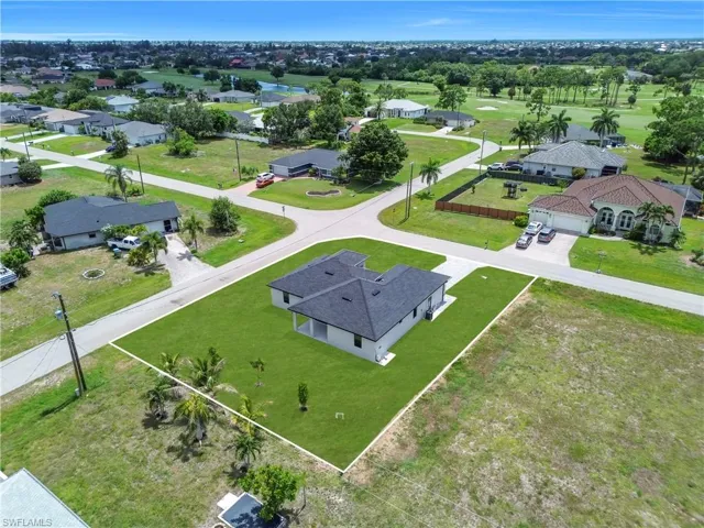 Aerial perspective highlighting a newly constructed residence on a corner lot