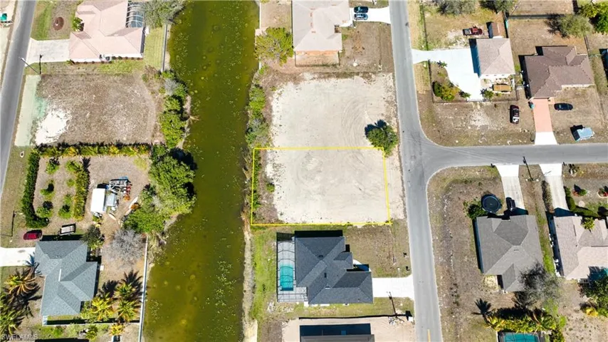 Aerial view of residential area with property boundaries highlighted