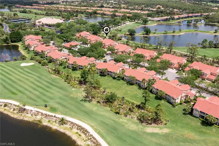 Aerial view featuring a water view, golf course view, and a residential view