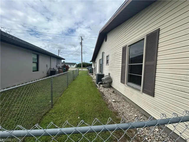 View of property exterior featuring a central AC unit