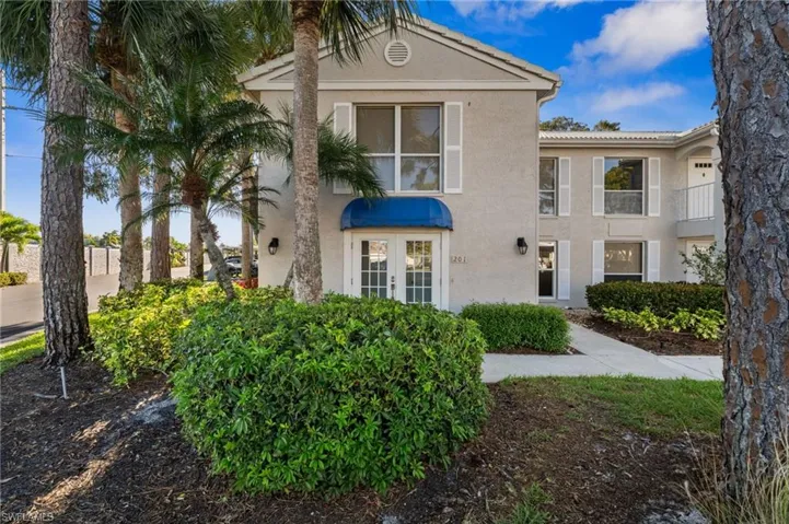 View of front of property with stucco siding and french doors