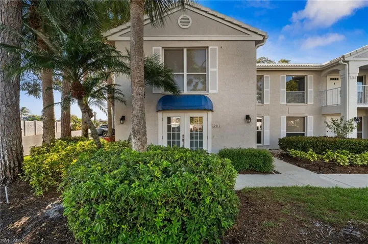 View of front of property featuring stucco siding and french doors