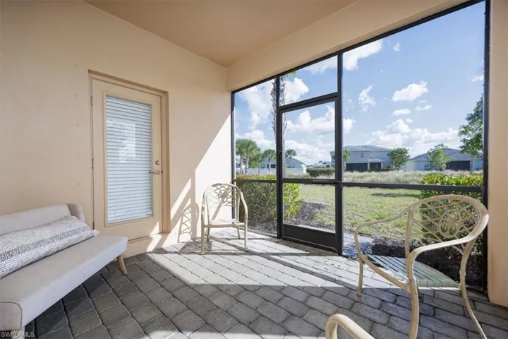 View from sunroom featuring a residential view and healthy amount of natural light