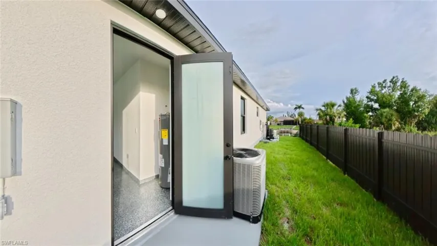 View of yard featuring water heater