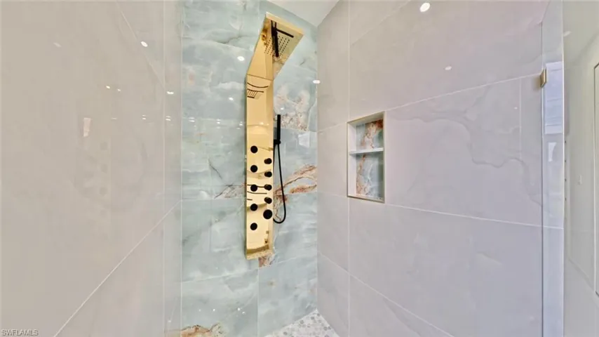 Bathroom featuring tiled shower