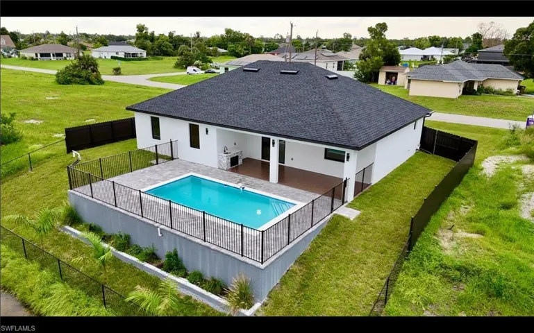 View of pool with a patio, a residential view, and a fenced backyard
