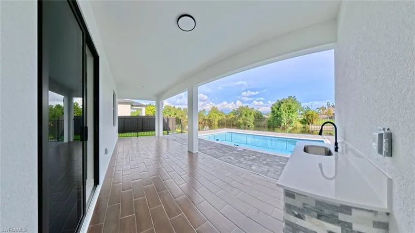 View of swimming pool featuring a patio area and a fenced backyard