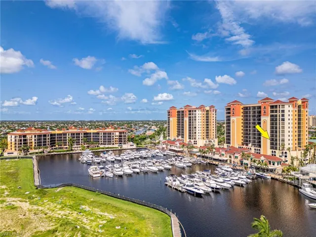 Birds eye view of property with a water view