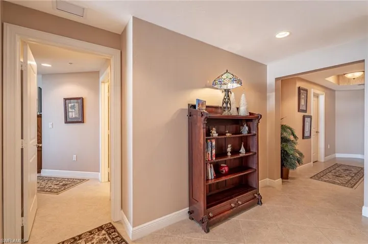 Hallway featuring light tile patterned flooring