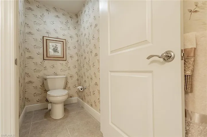 Bathroom with tile patterned flooring and toilet