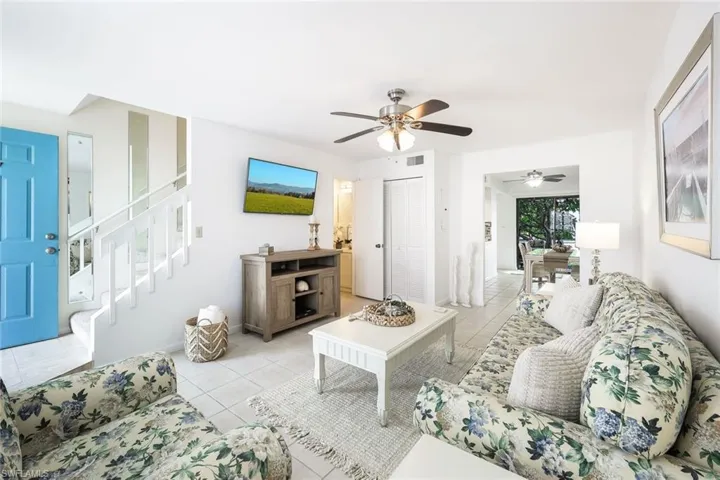 Tiled living room with ceiling fan