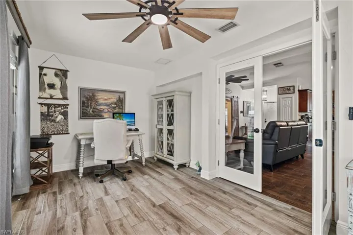 Office space featuring double French doors