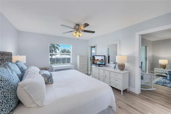Bedroom with light hardwood / wood-style flooring and ceiling fan