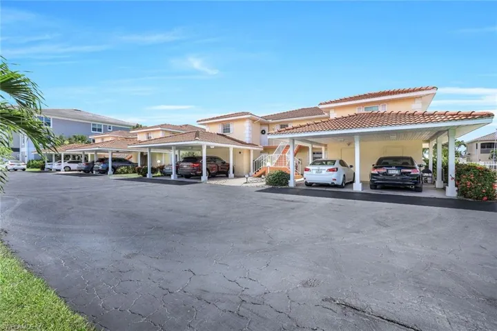 View of building exterior with a carport