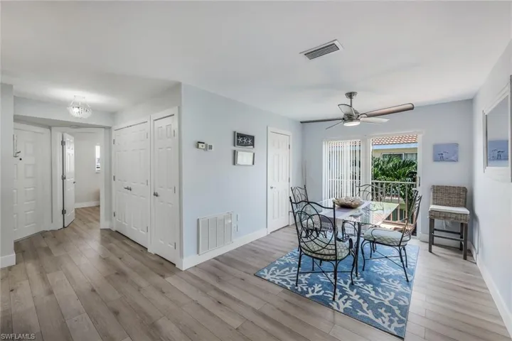 Dining area featuring ceiling fan and light wood-type flooring