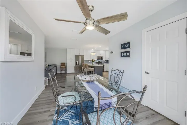 Dining area featuring hardwood / wood-style flooring and ceiling fan