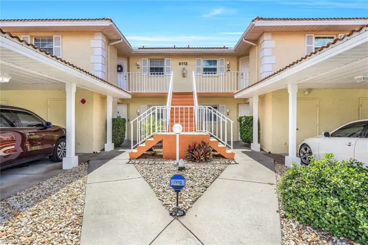 View of front of home with a balcony