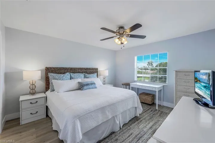 Bedroom with light wood-type flooring and ceiling fan