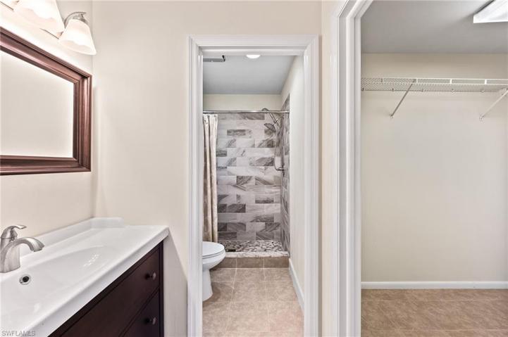 Updated Primary Bath and Shower with Adjacent Walk-in Closet
