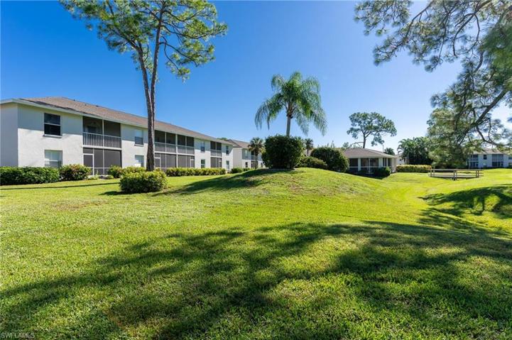 Rear Exterior View with Community Pool in Background