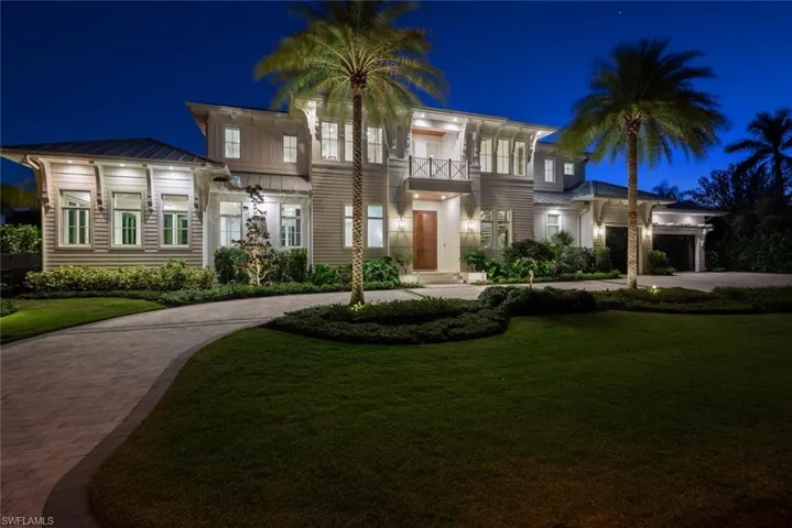 Night elevation featuring landscape and canopy lighting