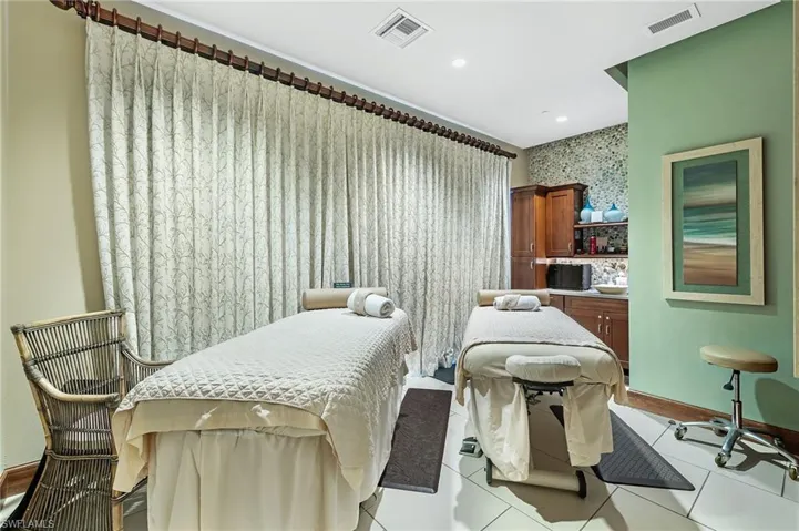 Bedroom featuring light tile patterned floors and recessed lighting