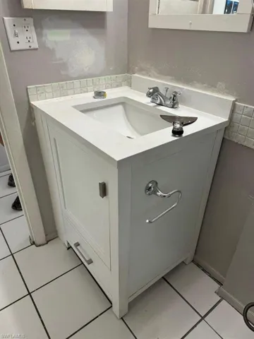 Bathroom with tile flooring and oversized vanity