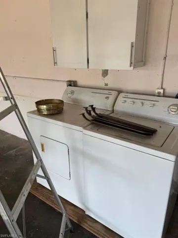 Laundry room featuring washing machine and dryer