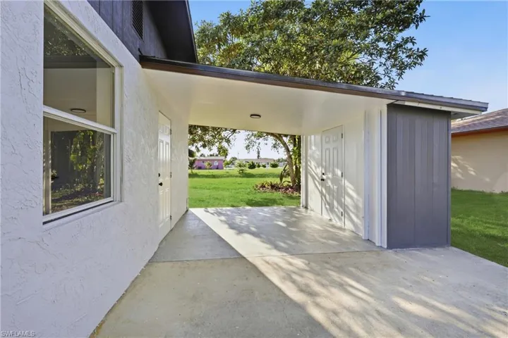 View of patio featuring an outdoor structure
