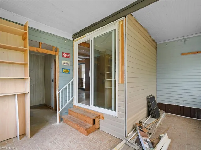Doorway to property featuring a patio area