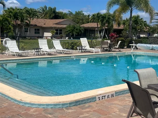Community pool featuring a patio