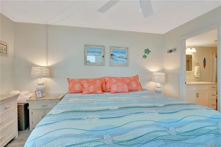Bedroom featuring a ceiling fan and ensuite bathroom