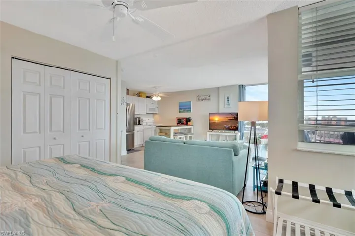 Full bath with light tile patterned floors, vanity, and a shower stall