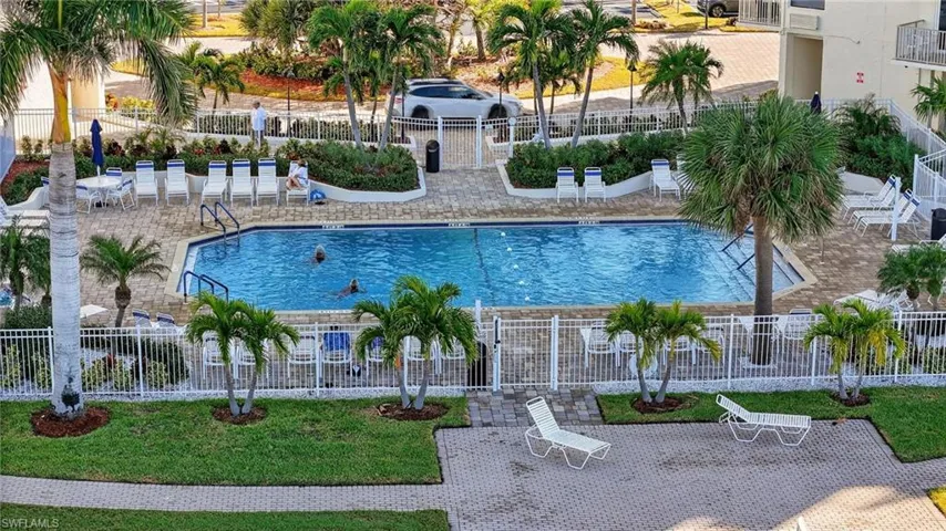 Community pool featuring a patio