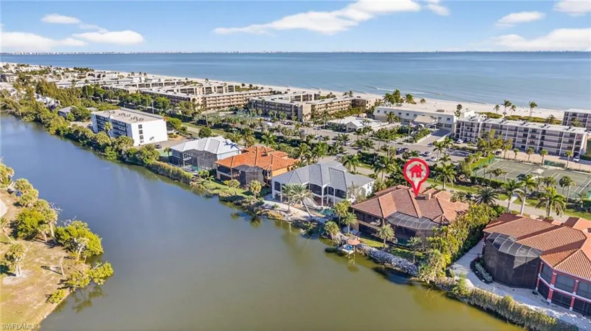 Bird's eye view of a large body of water and apartment complex