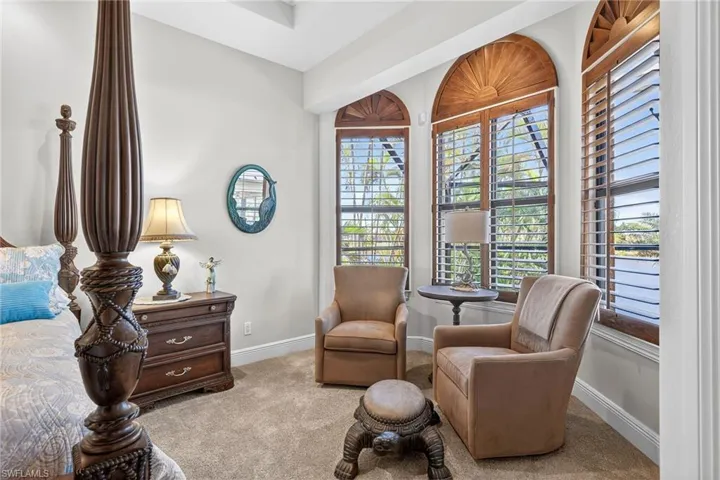 Sitting room featuring carpet and baseboards