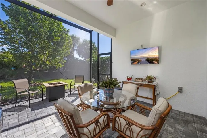 Covered lanai with extended patio and screen cage. Pre-wired for flat-screen TV