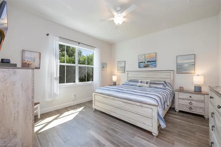 Owner's suite bedroom with pre-wired flat screen TV wall