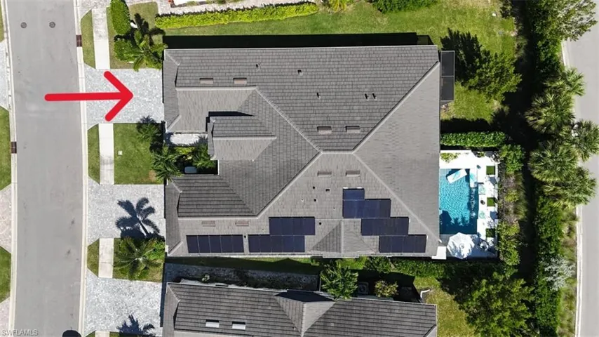 Drone / aerial of the attached villa. Driveway has pavers and backyard has plenty room for your own dream pool