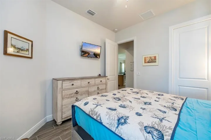 Guest bedroom with pre-wired flat screen TV wall