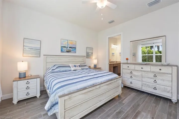 Owner's suite bedroom with beautiful ceiling fan