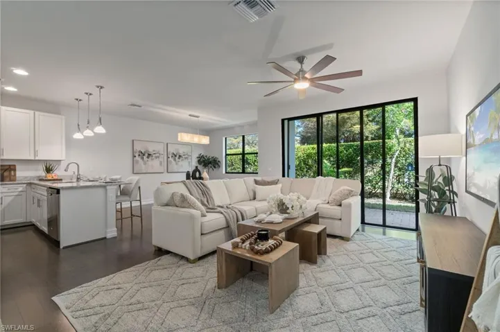 light, bright and airy—- a spacious open concept living area with abundant natural light and seamless flow to the outdoor space.