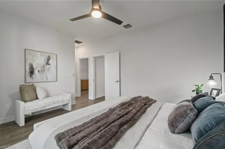 Bedroom with wood finished floors and a ceiling fan