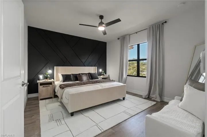 Spacious primary bedroom with custom feature wall, modern finishes and abundant natural light creating a calm and inviting retreat.