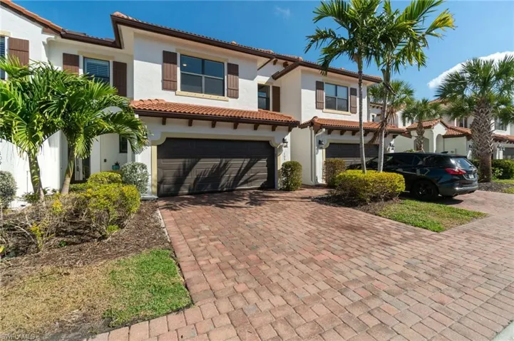 Well maintained exterior with paver driveway, tile roof and lush tropical landscaping delivering modern character and curb appeal.
