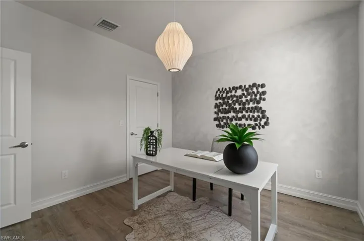 Home office featuring wood finished floors