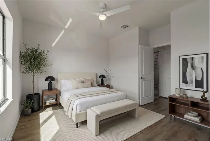 Bedroom featuring wood finished floors and ceiling fan