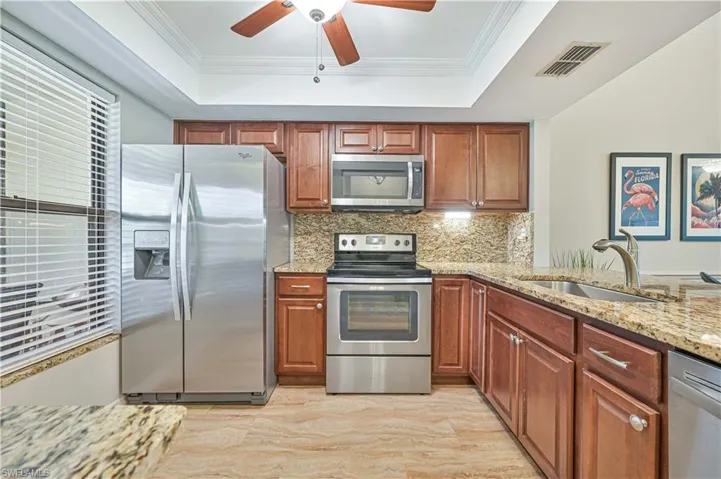 Remodeled kitchen with stainlees steel appliances and granite countertops.