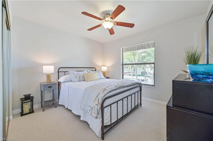 Guest bedroom with iron bed and brand new carpet.  They won't want to leave.